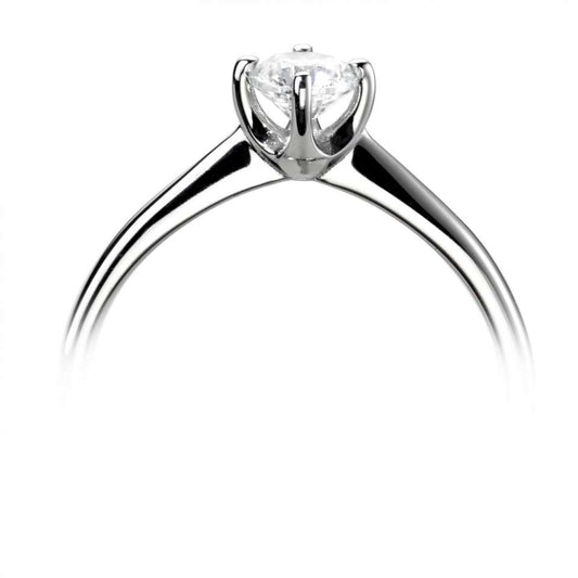 AN ORGANIC COMPASS SET FOUR CLAW SOLITAIRE WITH PLAIN SHOULDERS.