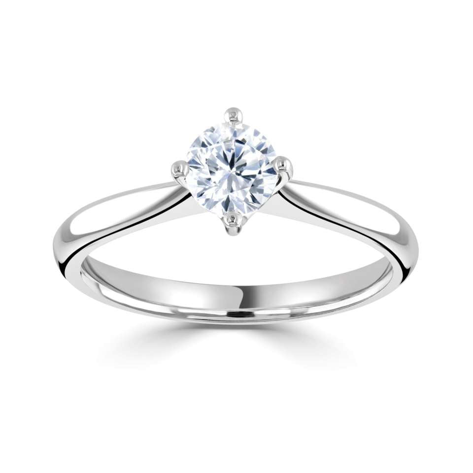 AN ORGANIC COMPASS SET FOUR CLAW SOLITAIRE WITH PLAIN SHOULDERS.