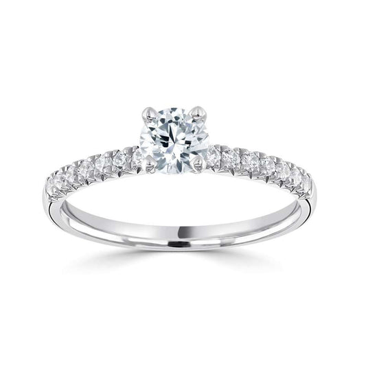 A MODERN FOUR CLAW ROUND SOLITAIRE WITH FISHTAIL SET DIAMOND SHOULDERS