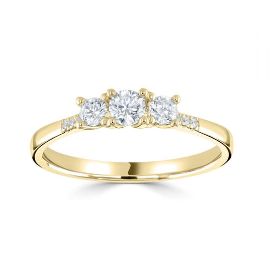 A CLASSIC ROUND THREE STONE RING WITH DIAMOND SET SHOULDERS.
