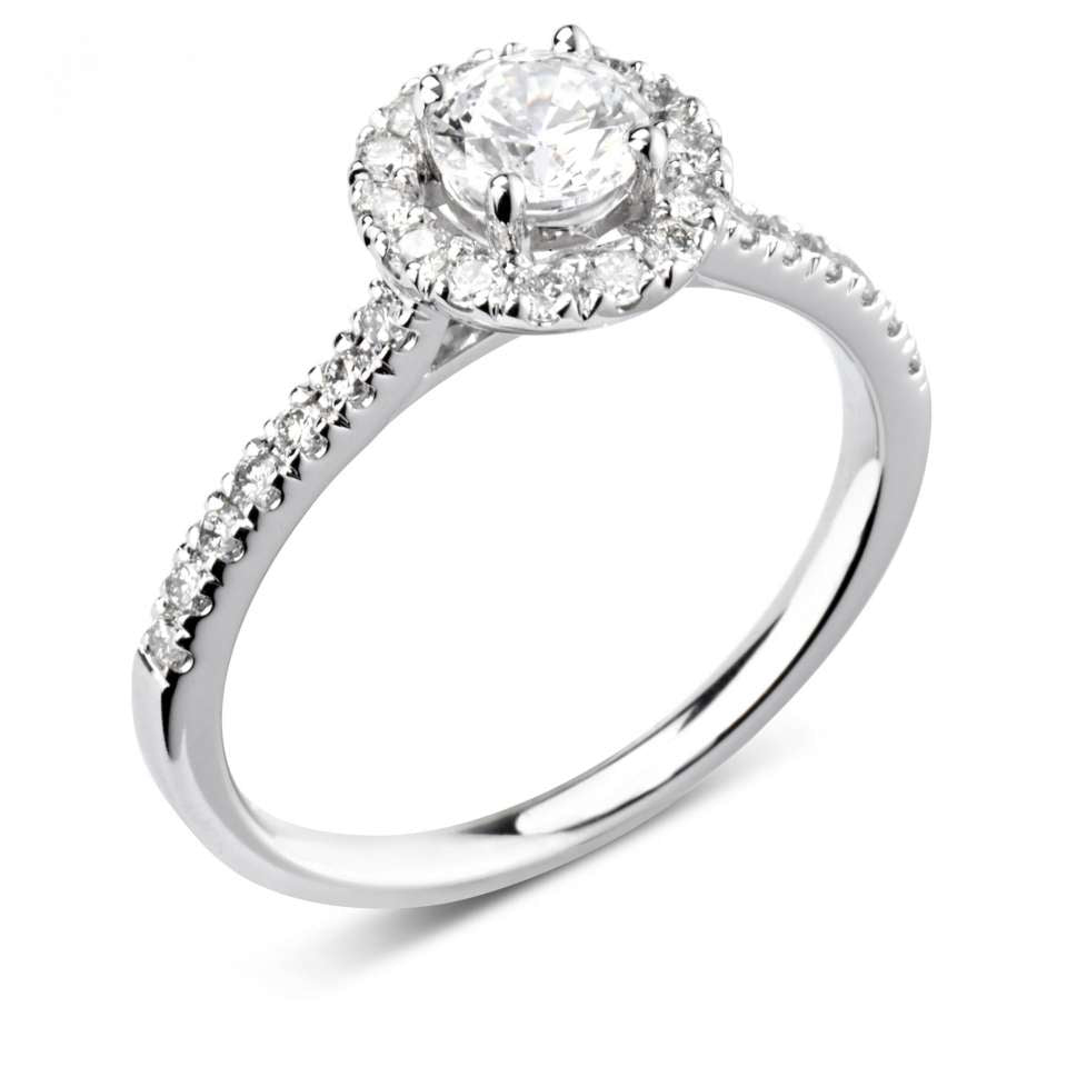 A CLASSIC ROUND HALO WITH DIAMOND SET SHOULDERS.